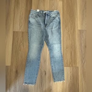 Good American Light Blue Cropped Jeans with Frayed Hem and Pockets